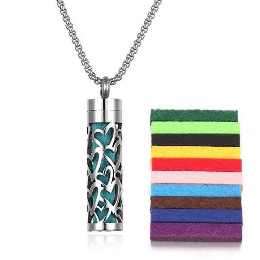 Premium aromatherapy diffuser pendant with turquoise lava stone design and chain, shown with colorful organic cotton pads for essential oil aromatherapy