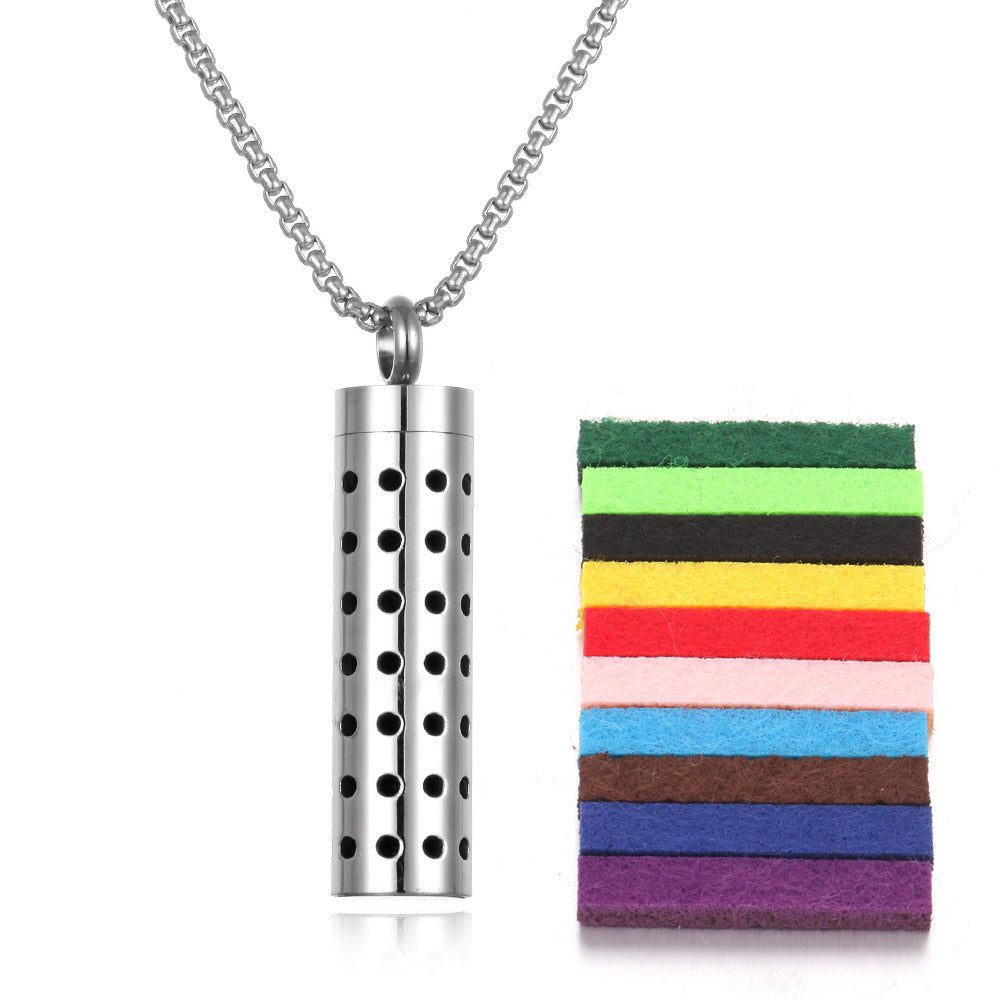 Premium aromatherapy pendant with geometric white dot pattern design on silver titanium steel body with chain
