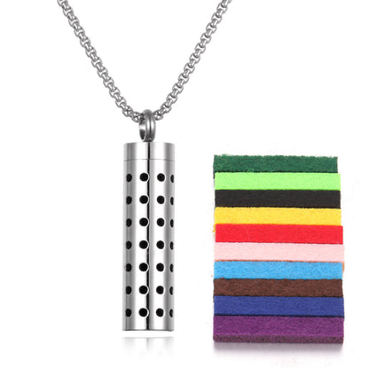 Premium aromatherapy pendant with geometric white dot pattern design on silver titanium steel body with chain
